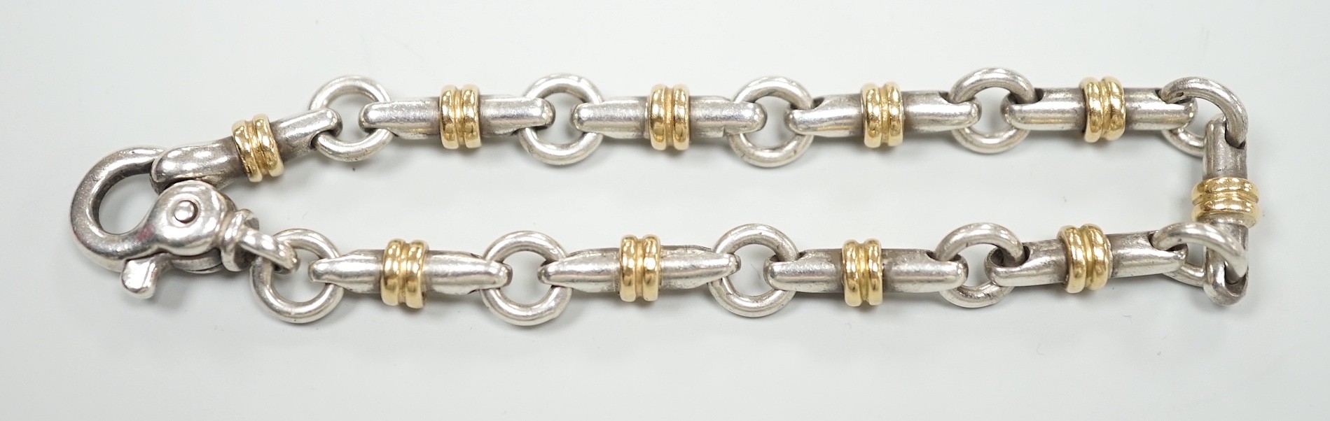 A modern Italian Tiffany & Co 750 yellow metal and 925 white metal, circular and baton link bracelet, 18cm.